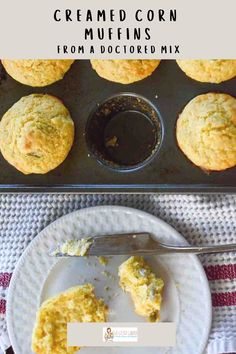 muffins are sitting on a plate next to a muffin tin with one missing