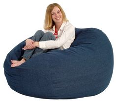 a woman sitting on a bean bag chair