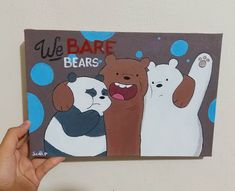 someone holding up a card with bears on it