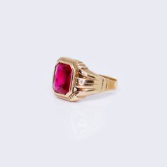 Indulge in luxury and elevate your style with our 10K Men Square Red Ring. Made from premium 10K gold, this ring exudes sophistication and exclusivity. The square design adds a modern touch while the vibrant red color makes a bold statement. Upgrade your accessory game with this unique and elegant piece. Details: Metal: 10K Gold Item #: MENR1-2 Red Rectangular 14k Gold Ring, Luxury Ruby Signet Ring For Formal Occasions, Classic Red Signet Ring For Formal Occasions, Classic Red 14k Gold Signet Ring, Classic 14k Gold Red Signet Ring, Luxury Red Signet Ring, Modern Red Ring For Formal Occasions, Red Rectangular Ring With Polished Finish, Modern Red Rings For Formal Occasions