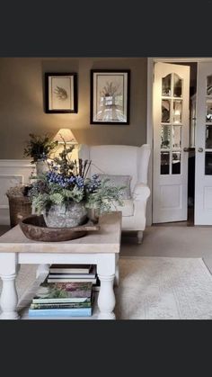 a living room filled with furniture and flowers