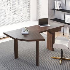 an office desk with a laptop on it