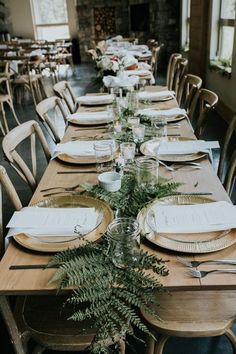 a long table set with plates and place settings