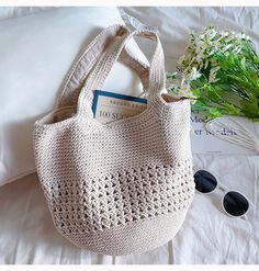 This Elena Handbags Large Crochet Cotton Bucket Bag offers a sophisticated, yet eye-catching design that is both timeless and chic. Crafted with superior crochet cotton, this elegant bag features a retro style minimalistic design, perfect for expressing your unique style and making a subtle statement. 100% handmade crochet handbag. Please hand wash carefully with cold water and a mild soap. Do not bleach. Do not iron. Material: Cotton Yarn Size approximately 11.5"H x 12"W x 1"D Strap drop length Elegant Crochet Bag For Daily Use In Spring, Elegant Beige Crochet Bag With Large Capacity, Trendy Everyday Cotton Crochet Bag, Elegant Handheld Crochet Bag With Large Capacity, Trendy Cotton Crochet Bag For Everyday, Chic Crochet Cream Shoulder Bag, Elegant Crochet Bag For Everyday, Chic Cream Crochet Shoulder Bag, Elegant Everyday Crochet Bag For Summer