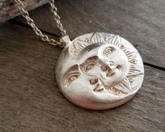 This celestial sun and moon pendant necklace is made by using the ancient lost wax technique and it is hand forged. It comes in a sterling silver chain of your choice or a waxed cord and the pendant is 23gr solid sterling silver made in great detail. A unique, ethereal piece of jewelry that will add character to any look and is ideal as a gift to yourself or to someone special. The total length of the chain is 460mm, please contact me if you would like me to custom made the length of your chain. Celestial Sun And Moon Sterling Silver Necklace, Sterling Silver Sun And Moon Spiritual Necklace, Sterling Silver Spiritual Necklace With Sun And Moon Design, Spiritual Sterling Silver Necklace With Sun And Moon Design, Spiritual Sterling Silver Sun And Moon Necklace, Silver Sterling Silver Necklace With Sun Design, Celestial Sterling Silver Necklace With Sun Design, Silver Celestial Necklace With Sun Design, Sterling Silver Necklace With Sun Design