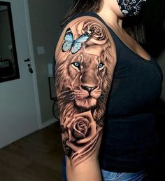 a woman with a lion tattoo on her arm