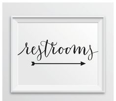 the word restrooms in cursive writing on a white background with an arrow