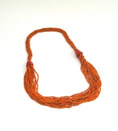 here is a wonderful  and bold orange statement glass beaded rope necklace from kenya,  africa.    the masai.    this measures about 28 inches in length.     although this is vintage,     it  still makes a bold statement.    so why not,    need a vintage gift ? Orange Multi-strand Hand-strung Jewelry, Traditional Orange Multi-strand Jewelry, Orange Hand-strung Multi-strand Jewelry, Orange Bohemian Hand-strung Beaded Necklace, Bohemian Fair Trade Orange Jewelry, Fair Trade Bohemian Orange Jewelry, Fair Trade Orange Bohemian Jewelry, Handmade Multi-strand Orange Beaded Necklaces, Orange Multi-strand Bohemian Beads