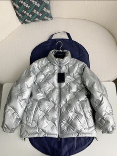 Indulge in the luxurious warmth and iconic style of our Glossy Puffer Jacket, capturing the essence of Louis Vuitton Design. Its lustrous diamond-quilted design and flattering silhouette will keep you cozy and effortlessly chic all season. This is a high quality replica. Luxury Quilted Puffer Jacket, Luxury Quilted Long Sleeve Outerwear, Luxury Long-sleeve Quilted Outerwear, Luxury Quilted Puffer Jacket With Long Sleeves, Luxury Quilted Puffer Jacket For Cold Weather, Luxury Quilted Puffer Jacket For Fall, Luxury Quilted Long Sleeve Puffer Jacket, Luxury Quilted Puffer Jacket For Winter, Designer Quilted Puffer Jacket For Winter