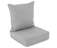 an outdoor chair cushion with a square pillow on the back and side, in grey linen