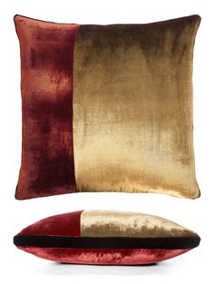 a red and gold pillow sitting on top of a white floor next to a cushion