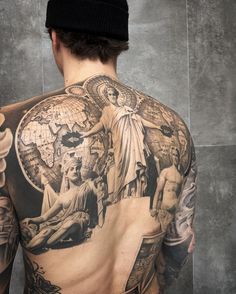 the back of a man with tattoos on his body