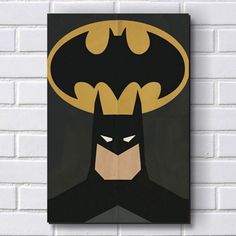 a batman poster hanging on the wall next to a white brick wall with a black background