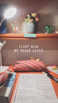 an open book sitting on top of a desk next to a lamp and bookshelf