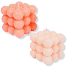 two candles made out of balloons on a white background