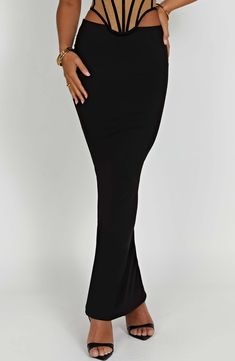 Astrid is our brand new figure skimming maxi skirt. cut from premium double layered jersey with stretch. With a flattering high rise fit. the design is made with your curves in mind and looks amazing paired with the Estella corset. Colour: Black. Premium double layered jersey. Super stretchy. Figure hugging fit. High waist. Maxi length. Model is a Size XS and is wearing an XS. Long Sleeve Homecoming Dresses, Dresses Flowy, High Waist Long Skirt, Homecoming Dresses Long, Maxi Dress Sale, Plain Dress, Sparkle Dress, Dresses By Length, Formal Dresses Prom