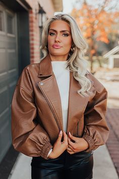 Add an edgy touch to your fall wardrobe with our chic chocolate colored 'Koty' jacket featuring faux leather material, a zip closure front with a collared neckline, long loose sleeves with elastic fitted cuffs, a single accent chest pocket cut and two low pockets, and a trendy bomber silhouette that ends in a straight hemline! Measurements S : Bust 38", Hip 34", Length 19.5", Sleeve Length 20", Waist 36". M : Bust 40", Hip 36", Length 20", Sleeve Length 20.5", Waist 38". L : Bust 42", Hip 38", L Accent Chest, Loose Sleeves, Faux Leather Jacket, Model Fits, Women Clothing Boutique, Faux Leather Jackets, Fall Wardrobe, Leather Material, Online Womens Clothing