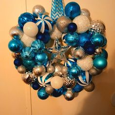 a blue and white christmas ornament hanging on a wall