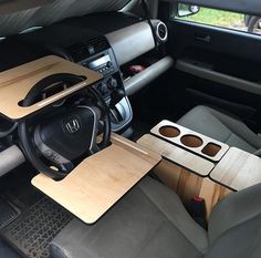 the interior of a car with wooden seats