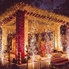 a decorated stage with white and red lights