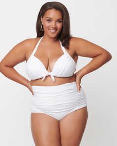 This stunning retro swim top is perfect for all shapes and sizes! It has an ultra-supportive fit with lightly padded cups, thick halter straps and an adjustable back strap. Get ready to turn heads in the Unique Vintage Solid White Monroe Halter Swim Top - a mix of classic pinup sex appeal and modern modesty! Soak up the sun in this plus-size bikini top from our extended size swimwear collection. Unique Vintage Unique Vintage Plus Size Solid White Monroe Halter Swim Top | White | Swimsuits | Materials & Care Instructions: ['82% Nylon, 18% Spandex', 'Hand wash', 'Imported'] Bright Swimwear, Retro Swim, Mermaid Parade, High Waisted Swim Bottoms, Halter Swim Top, Vintage Plus Size, Swimsuit Material, Plus Size Swim, Retro Tops