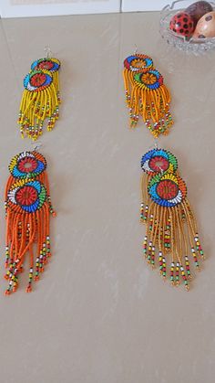 Wholesale African earrings, Beaded earrings, Boho earring, Elegant assorted earrings, Zulu earring, Gift for her, Tribal earring The listing is for ALL 12 pieces . These Zulu beaded earrings are superbly crafted which can be worn with any outfit at different occasions and they will absolutely make you stand out. These colorful earrings are very light to wear. Selecting one quantity means that you receive the 14 pairs. If you want to rule out some colors and replace them with others of your choic Colorful Beads Drop Earrings For Festivals, Traditional Beaded Earrings With Round Beads, Festival Earrings With Round Beads And Ear Wire, Festival Colorful Bead Drop Earrings, Traditional Multicolor Earrings With Colorful Beads, Traditional Multicolor Beaded Earrings, Festival Beaded Drop Earrings, Traditional Single Round Bead Earring, Traditional Single Earring With Round Beads