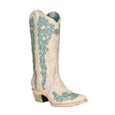 a pair of white boots with blue embroiderys on the side and heeled toes