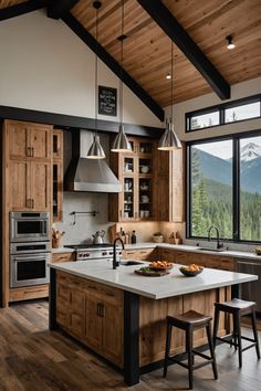 a large kitchen with wooden cabinets and an island in front of a window overlooking the mountains