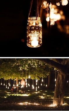 mason jar lights hanging from trees in the dark and on the ground, lit up at night