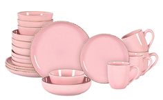 a pink dinnerware set with matching cups and saucers is shown on a white background