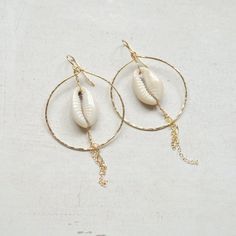 Cowrie shell earrings, Gold chain hoops, Cowrie shell hoop earrings, Beachy earrings Beachy Gold Dangle Earrings, Bohemian 14k Gold Filled Jewelry For Beach, Bohemian Gold Hoop Earrings With Dangling Charms, Handmade 14k Gold Filled Jewelry For The Beach, Gold Shell-shaped Hoop Earrings For Beach, Handmade Gold Hoop Earrings For Vacation, Handmade 14k Gold Filled Beach Earrings, Handmade 14k Gold Filled Earrings For Beach, Handmade 14k Gold-filled Earrings For Beach