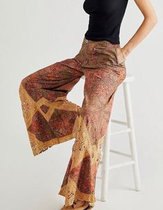 Free People These stunning pants are featured in a mid-rise, exaggerated wide-leg silhouette with vintage-inspired floral print and crochet lace piecing throughout. Zip fly and button closure Side pockets Relaxed, billowy, wide-leg fit Size 10 (medium) Waist, across the front, measures approx 16 inches Rise measures approx 11 inches Inseam measures approx 31.5 inches New with tags Hundreds of new Free People clothes, shoes and BAGS just listed. Lots of fabulous stuff! Frye Veronica Short, Printed Pants Outfits, Sweet Surrender, Chef Pants, Long Sleeve Layer, 70s Inspired Fashion, Silky Top, Cuffed Top, People Clothes