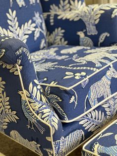 an upholstered blue chair and matching footstool