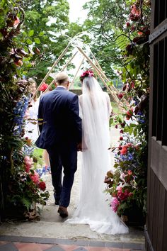 the bride and groom are walking down the aisle