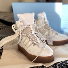 These White Super Sleek Boots From The Original Adidas X Ivy Park Drop Were A Size Too Small And Are Waiting For You To Rock Them! Tags On, In Original Packaging With An Ivy Park Canvas Bag + Box For Storage. Sporty Boots With Vibram Sole, White Sporty Lace-up Boots, Sporty White Lace-up Boots, Sporty Boots With Reinforced Heel, White Sporty Platform Boots, Round Toe Boots With Laces And White Sole, Sporty White Leather Boots, Sporty Lace-up Boots With White Sole, Sleek Boots