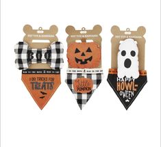 three dog bandanas with halloween designs on them, one is black and the other is white