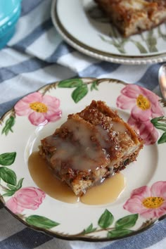 a piece of cake sitting on top of a white plate covered in caramel sauce