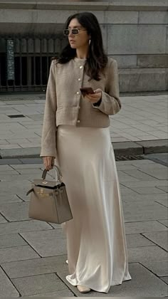 mid waist. flowy fit. side zipper closure. Chic Beige Lined Maxi Skirt, Chic Beige Formal Maxi Skirt, Chic Beige Maxi Skirt For Formal Occasions, Formal Chic Beige Maxi Skirt, Elegant Beige Maxi Skirt For Work, Formal Beige Relaxed Fit Maxi Skirt, Beige Flared Maxi Skirt For Fall, Fall Beige Lined Maxi Skirt, Elegant Beige Maxi Skirt For Spring