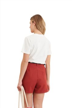 Clever Alice Folded Short in Red Add a pop of color to your wardrobe with the Clever Alice Folded Short in vibrant red. Imported from France, these shorts are crafted with a premium blend of 80% cotton and 20% Tencel, offering unmatched comfort and breathability. The folded hem design and tailored fit make them a chic choice for any casual or semi-formal occasion. Key Features: Premium Fabric Blend: Made with 80% Cotton and 20% Tencel for a soft, lightweight, and breathable feel. Folded Hem Deta Relaxed Fit Red Shorts With Pockets, Red High-waisted Relaxed Fit Shorts, Playful Red Cotton Shorts, Stylish Shorts, Leather Pant, Leather Dresses, Pop Of Color, Sweater And Shorts, Denim Pant