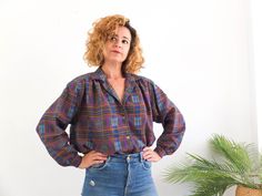 Amazing vintage 80s colorful plaid button down blouse with retro secretary style. This 80's tartan plaid blouse has puff sleeve and collared with buttons front, it's pleat shoulder with boxy shape. The 1980s secretary blouse is winter cozy polyester fabric in excellent vintage conditions (Made in Spain). The blouse is size XL to 2XL, depends on how tight you like it, the chest contour fit is 50,3 inches (128 cm) ** MEASURES FLAT ** Armpit to armpit 25,1 in // 64 cm Sleeve 21,6 in // 55 cm Should Plaid Collared Blouse For Fall, Plaid Relaxed Fit Blouse For Fall, Fall Plaid Collared Blouse, Retro Relaxed Fit Blouse For Fall, Retro Plaid Blouse For Fall, Vintage Plaid Blouse For Fall, Vintage Plaid Tops For Fall, Vintage Plaid Tops For Work, Retro Secretary