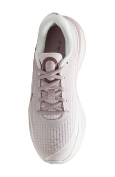 A contoured fit helps your feet feel secure in this flexible running shoe designed with ample cushioning and reliable stability so you can run the extra mile. Textile and synthetic upper/textile lining/rubber sole Imported Pink Synthetic Running Shoes With Arch Support, Nike Running Shoes With Air Cushioning For Workout, Pink Running Shoes With Arch Support For Workout, Pink Workout Running Shoes With Arch Support, Athleisure Running Shoes With Air Cushioning And Secure Fit, Synthetic Running Shoes With Gel Cushioning And Athletic Fit, Synthetic Running Shoes With Secure Fit, Workout Running Shoes With Arch Support, Nike Athleisure Running Shoes With Air Cushioning