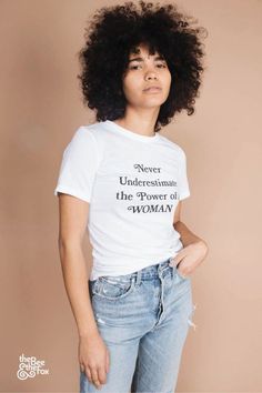 This vintage-inspired tee combines retro shirt design with a powerful message. The Never Underestimate the Power of a Woman Shirt makes a bold statement in any tshirt outfit while paying homage to 70s inspired fashion. Add it to your graphic tees outfit for a timeless look that champions strong women. Retro Shirt Design, 70s Inspired Fashion, Crewneck Style, A Force, Quote Tees, Fitted Tee, Never Underestimate