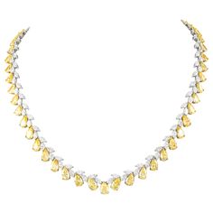 Beautiful yet unique alternating diamond tennis necklace. High jewelry by Alexander Beverly Hills. 50.14 carats total diamond weight. 58 pear shape yellow diamonds, 35.42 carats. Approximately Fancy Yellow color and VS-SI clarity. 118 marques cut diamonds, 14.72 carats. Approximately D-E color and VS clarity. 18k yellow and white gold, 47.30 grams, prong set, 17.5in. Accommodated with an up-to-date appraisal by a GIA G.G. once purchased, upon request. Please contact us with any questions. Item N 1stdibs Jewelry, Yellow Diamond Necklace, Diamond Collar, White Diamond Necklace, Diamond Tennis Necklace, Yellow Diamonds, Yellow Jewelry, Marquise Cut Diamond, Expensive Jewelry