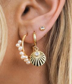 Description - Elevate your style this summer with our new Sunburst Hoops. These unique bold hoops go with every summer outfit, making them a staple in your jewelry collection. From a bikini on the beach to a flowy dress with sandals, dress them up or down with ease all summer long. Premium Copper + 18k gold PVD coating Hoop width ~ 10mm Water-Resistant Hypoallergenic Gift ready packaging Free stickers Trendy Gold Jewelry For Summer, Beachy Everyday Summer Jewelry, Beachy Gold Jewelry For Summer, White Jewelry For Summer Beach Party, Trendy Everyday Jewelry For Beach Season, White Summer Jewelry For Beach Party, Summer Beachy Gold Jewelry, White Summer Beach Party Jewelry, Adjustable Summer Jewelry For Beach