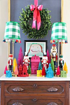 an old dresser is decorated with christmas decorations and figurines for the holiday season