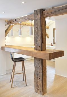 a bar made out of wood with two stools