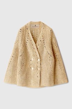 an open knit cardigan sweater with holes on the front and back, in beige