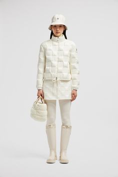 Crafted from longue saison, the Ancy down jacket offers lightweight warmth. Inspired by the '60s, this long jacket features a quilted checkerboard motif. Winter White Long Sleeve Quilted Jacket, Winter White Quilted Nylon Outerwear, Quilted Nylon Outerwear In Winter White, Luxury Long-sleeve Quilted Outerwear, Designer Quilted Down Puffer Jacket, Luxury Quilted Puffer Jacket For Fall, Luxury Quilted Long Sleeve Outerwear, Designer Quilted Nylon Puffer Jacket, Designer Quilted Nylon Outerwear