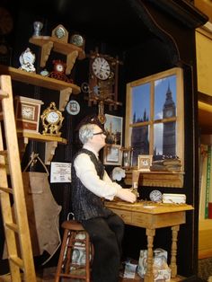 a doll is sitting at a desk with clocks on the wall and shelves behind it