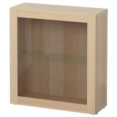 a wooden cabinet with glass doors on the front and bottom shelves in light wood finish